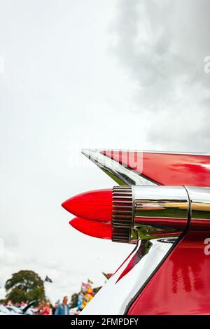 isolated view red bullet rear lights of vintage 1959 Cadillac Coupe de Ville at Stars & Stripes American Classic car show Stock Photo