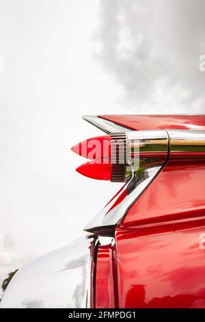 isolated view red bullet rear lights of vintage 1959 Cadillac Coupe de Ville at Stars & Stripes American Classic car show Stock Photo