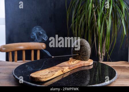 incense with smoke on design holder Stock Photo