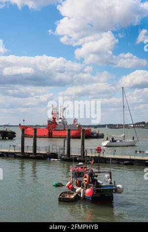 Harwich UK, view of the harbour in Harwich with the red Trinity House lightship visible on the River Stour estuary, Essex, England, UK Stock Photo
