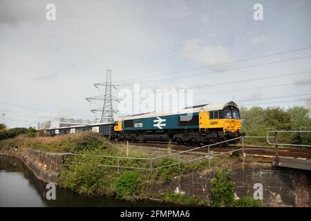 GB Railfreight Class 66 loco 66789 hauling the 0826 Rylstone Tilcon to Scunthorpe service alongside the Stainforth & Keadby canal on 11/5/21. Stock Photo