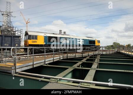 GB Railfreight Class 66 loco 66789 hauling the 0826 Rylstone Tilcon to Scunthorpe service over the Stainforth & Keadby canal on 11/5/21. Stock Photo