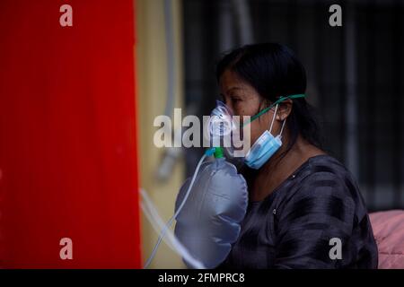 Kathmandu, Nepal. 11th May, 2021. A patient infected with COVID-19 is seen outside the corridor of a hospital in Kathmandu, Nepal, on May 11, 2021. Credit: Sulav Shrestha/Xinhua/Alamy Live News Stock Photo