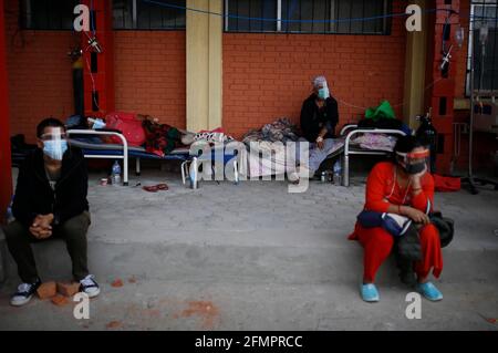 Kathmandu, Nepal. 11th May, 2021. Patients infected with COVID-19 are seen outside the corridor of a hospital in Kathmandu, Nepal, on May 11, 2021. Credit: Sulav Shrestha/Xinhua/Alamy Live News Stock Photo