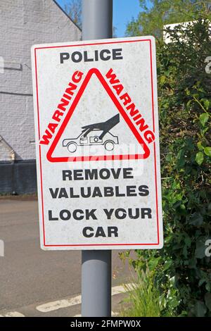A Police information sign warning of theft from cars by Malthouse Broad on the Norfolk Broads at Ranworth, Norfolk, England, United Kingdom. Stock Photo