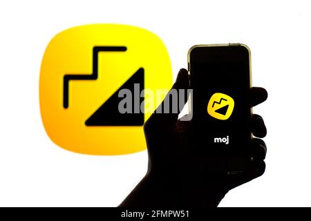 Spain. 11th Mar, 2022. In this photo illustration a Louis Vuitton logo seen  displayed on a smartphone with a Louis Vuitton logo in the background.  (Credit Image: © Thiago Prudencio/SOPA Images via