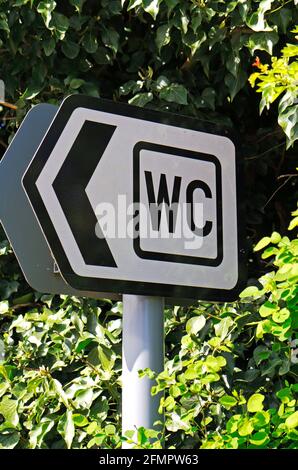 A roadside sign indicating direction to WC and Public Toilets in the Norfolk Broads at Ranworth, Norfolk, England, United Kingdom. Stock Photo