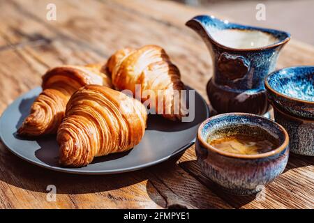 Breakfast with Chinese tea and fresh pastries, aromatic butter croissants. Tea ceremony. Stock Photo