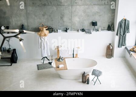 White modern bath in contemporary apartment with stylish loft style interior design, home decor. Soft selective focus. Stock Photo