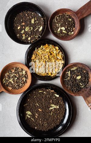 Directly above shot of variety of masala chai tea leaves in bowls Stock Photo