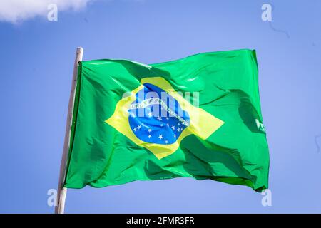 Brazil national flag textile cloth waving on top, blue sky brazil, patriotism concept. Stock Photo