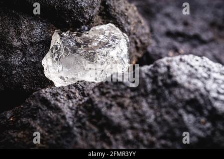 rough diamond, crystal in an allotropic form of carbon, uncut gemstone, concept of luxury or wealth Stock Photo