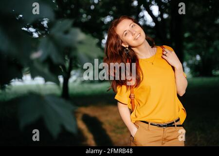 Portrait of a young curly girl in the dawn sunlight. Stock Photo