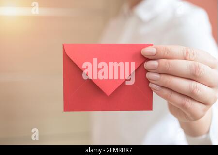 Closeup of young businesswoman holding envelope Stock Photo