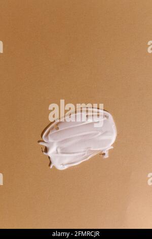 Cosmetic cream texture on neutral beige background Stock Photo