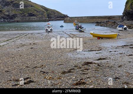 Port Issac Harbour with fishing boats and pleasure boat north Cornwall England UK Stock Photo