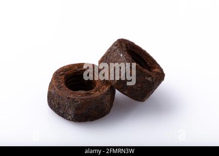old rusty aged bolt, not usable, rusty item on white background  Stock Photo
