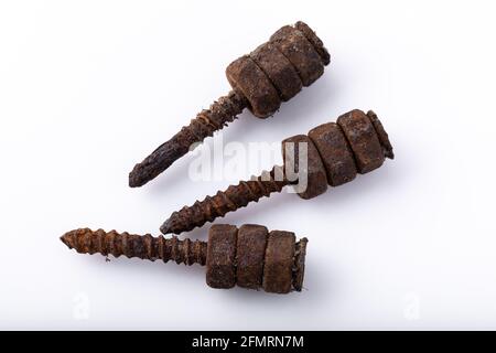 old rusty aged bolt, not usable, rusty item on white background  Stock Photo