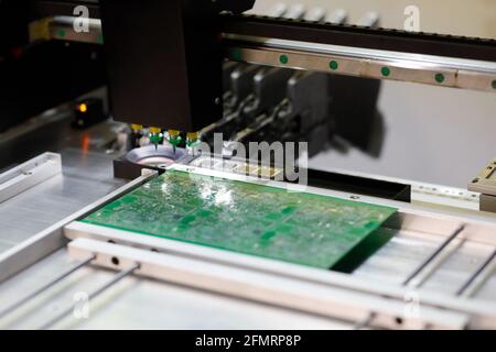 Automatic pick and place machine for PCB assembly. Surface mount technology. Selective focus. Stock Photo