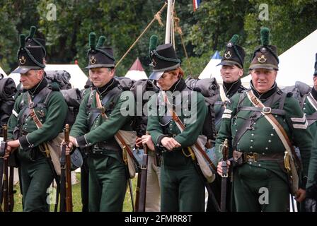 British light infantry of the famous 95th regiment of Rifles forming up in the Allied camp before the re-enactment of the Battle of Waterloo. Stock Photo