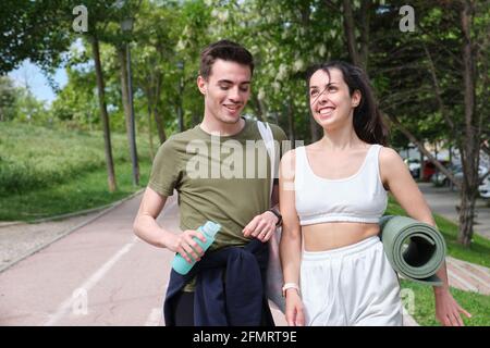Young sport couple talking and laughing. Fitness outside. Stock Photo