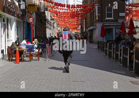 China Town - London (UK): Covid Marshals along with police patrol the west end of London advising members of the public about covid regulations. Stock Photo