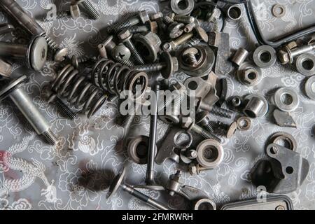 Top view of screws and nails on the ground Stock Photo