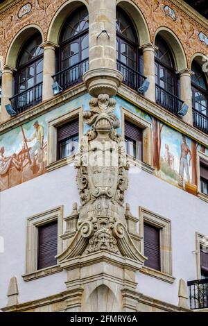 Guernica, Spain - April 09, 2018: Ancient house in classical style in Guernica. Decorated with paintings and sculptures. Stock Photo