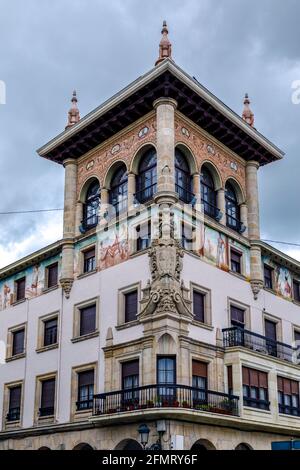 Guernica, Spain - April 09, 2018: Ancient house in classical style in Guernica. Decorated with paintings and sculptures. Stock Photo