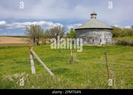 Old Wooden Round Barn During Spring Stock Photo