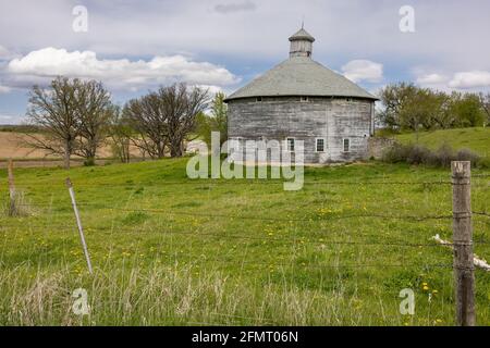 Old Wooden Round Barn During Spring Stock Photo