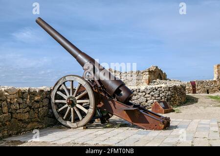 Morella, Spain - October 16, 2016: An Industrial Artillery Piece at the Morella Castle This canon was Placed in 1954 by the General Captain of Valenci Stock Photo