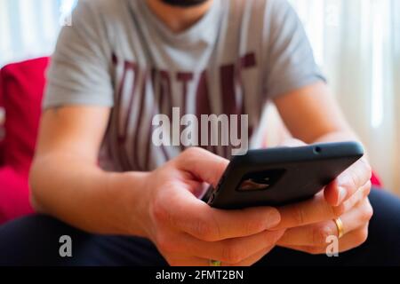 Male using a black smartphone Stock Photo