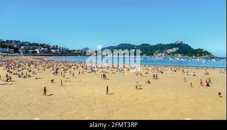 San Sebastian, Spain - August 22, 2016: Watches on the beach promenade of La Concha in San Sebastian in a sunny day on August Stock Photo