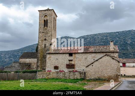 Virgen del Rosario Church in the rural town of Triste Aragon, Spain. Its Romanesque tower from the beginning of the XIII century Stock Photo