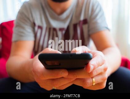 Male using a black smartphone Stock Photo