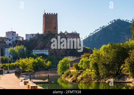 Castle of Sot de Chera on a hill surrounded by greenery under the sunlight in Spain Stock Photo