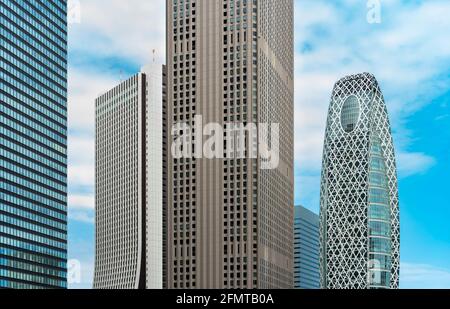 tokyo, japan - may 10 2021: Close up on the facades of nishi-shinjuku skyscrapers like the from left to right the shinjuku mitsui, the sompo japan, th Stock Photo