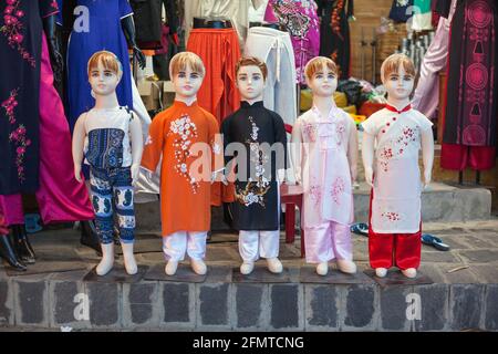 Couple Of Manequin In Vietnamese Traditional Dress Standing At Outdoor  Clothing Store Stock Photo, Picture and Royalty Free Image. Image 26910757.