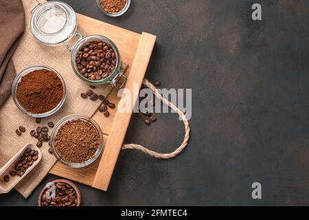 Grain, ground and instant coffee on a brown background. Top view, copy space. Stock Photo