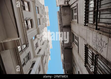 Residential building modern architecture in istanbul. Blue sky after narrow street and behind vintage apartments in istanbul near galata. Stock Photo