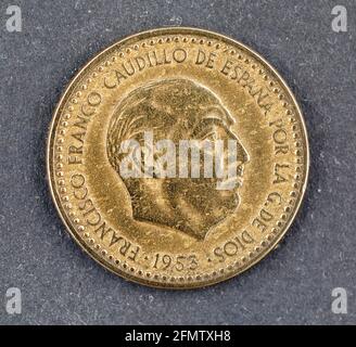 A one peseta coin from Spain dated 1953 during the reign of General Franco. The Peseta was once the currency of Spain but it became obsolete with the Stock Photo