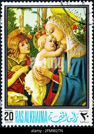 RAS AL KHAIMA - CIRCA 1968: A stamp printed in the Ras al-Khaimah shows Madonna and Child with the Young St John. Stock Photo