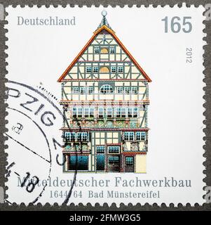 GERMANY - CIRCA 2012: Postage stamps printed in Germany, shows a half-timbered building in central Germany, Bad Munstereifel, circa 2012 Stock Photo