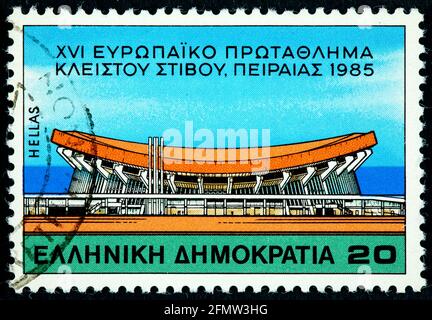 GREECE - CIRCA 1985: a stamp printed in the Greece shows The Peace and Friendship Stadium Neo Faliro Piraeus European Indoor Athletics Championships c Stock Photo