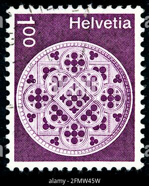 Postage stamp issued in the Switzerland with the image of the Rosette, Lausanne Cathedral. From the series on Architecture and Handicrafts, circa 1974 Stock Photo