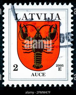 LATVIA - CIRCA 2007: A stamp printed in Latvia from the 'Coat of Arms' issue shows Auce coat of arms, circa 2007. Stock Photo