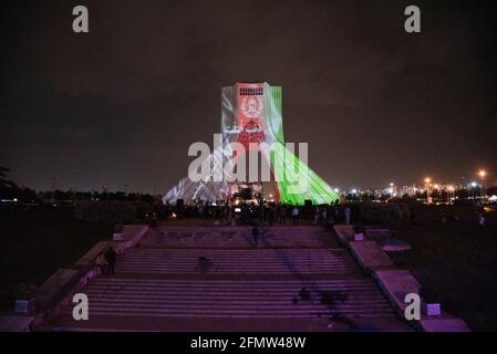 Tehran, Iran. 11th May, 2021. To memorial the victims of the terrorist attack in Dasht-e Barchi, Afghanistan flag video mapping was performed on the walls of Azadi Tower in Tehran, the capital city of Iran. (Photo by Sobhan Farajvan/Pacific Press) Credit: Pacific Press Media Production Corp./Alamy Live News Stock Photo