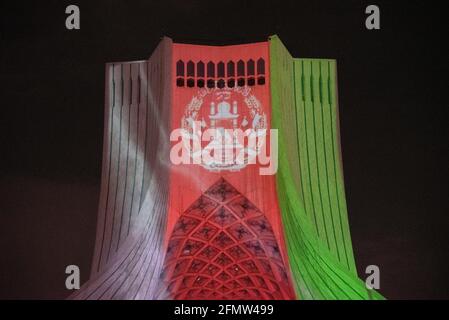 Tehran, Iran. 11th May, 2021. To memorial the victims of the terrorist attack in Dasht-e Barchi, Afghanistan flag video mapping was performed on the walls of Azadi Tower in Tehran, the capital city of Iran. (Photo by Sobhan Farajvan/Pacific Press) Credit: Pacific Press Media Production Corp./Alamy Live News Stock Photo