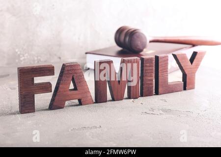 Word FAMILY with judge's gavel on light background Stock Photo